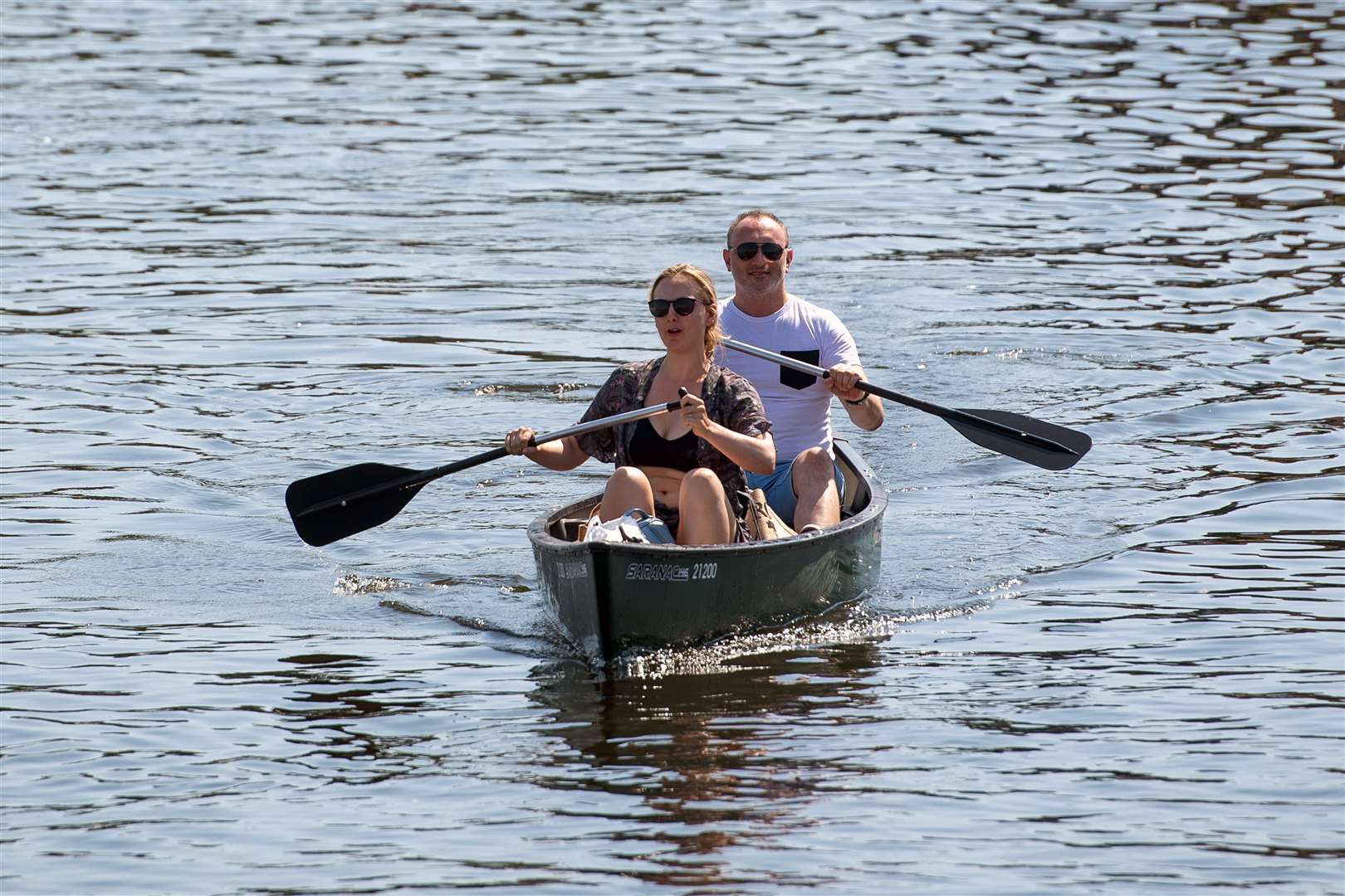 People canoe along the River Bure at Wroxham on the Norfolk Broads (Joe Giddens/PA)