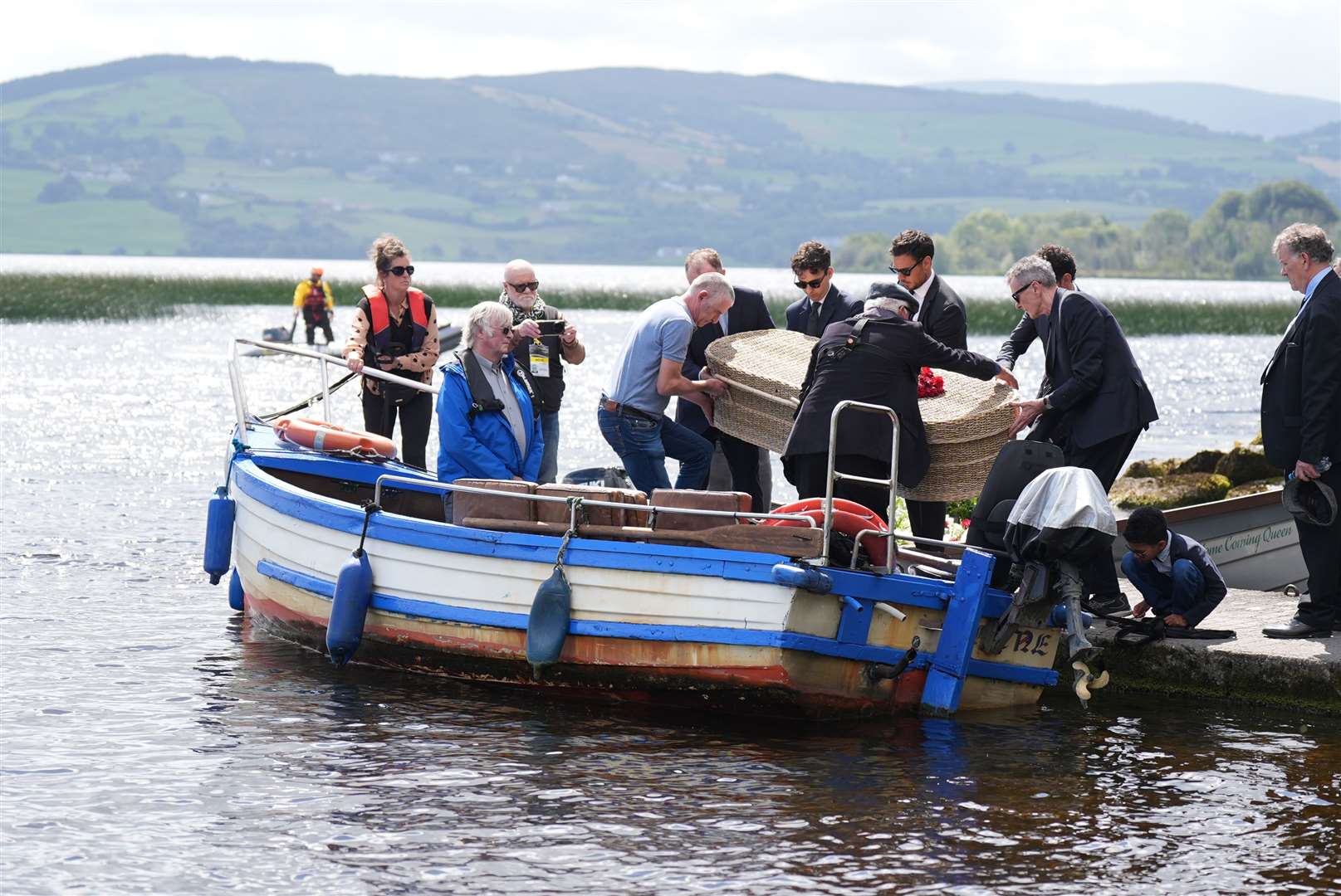 The wicker coffin was taken by boat across Lough Derg to Holy Island (Niall Carson/PA)