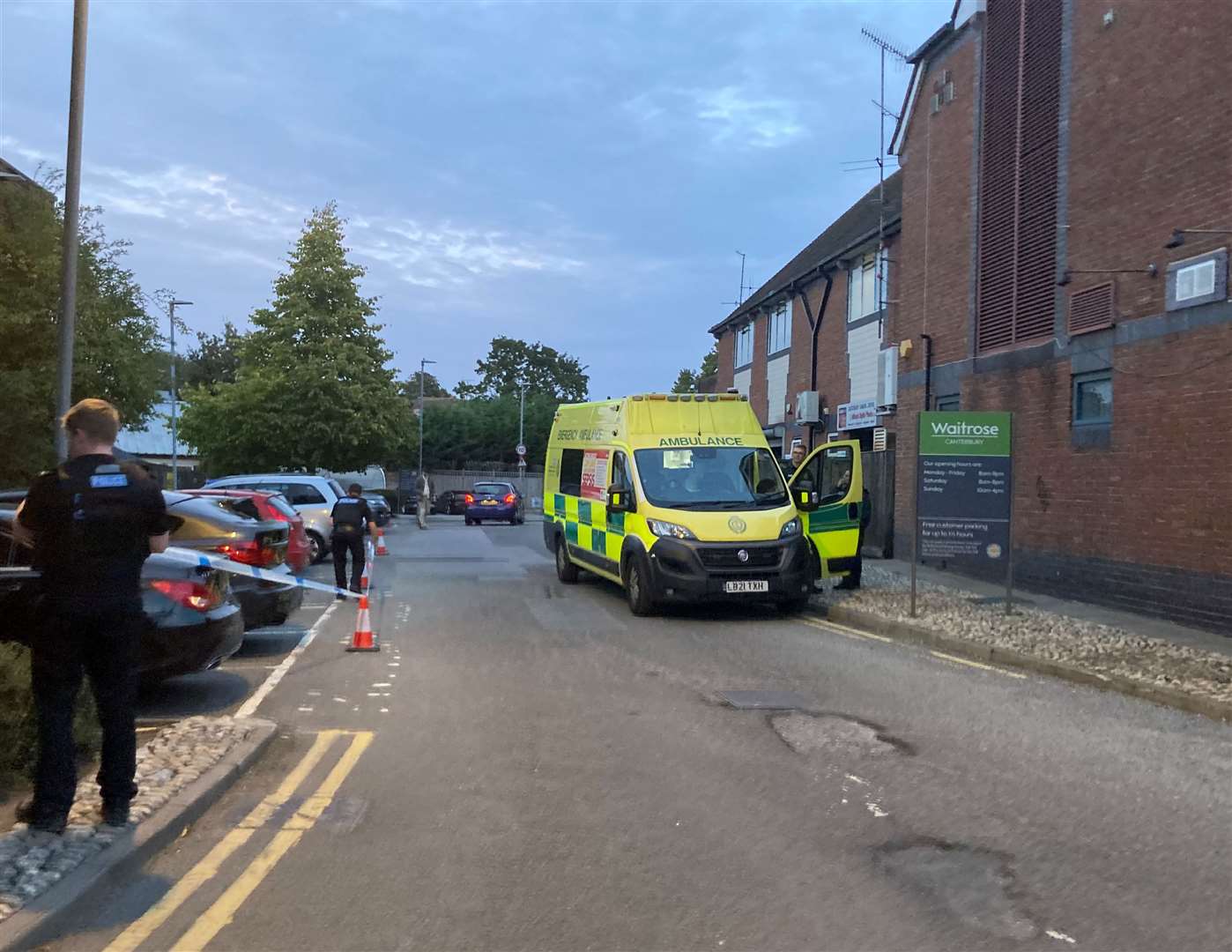 Police and the ambulance service at the scene behind Waitrose in Canterbury