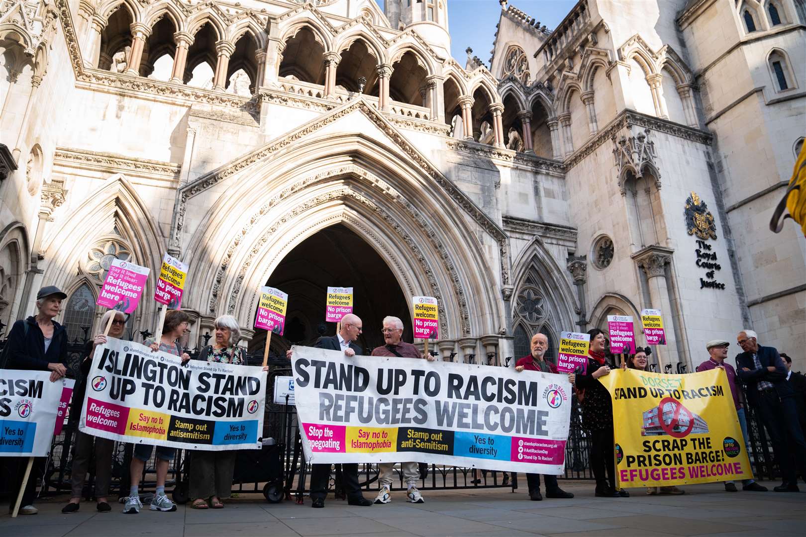 Dorset residents and supporters of Carralyn Parkes gathered outside the Royal Courts of Justice in London on Tuesday (James Manning/PA)