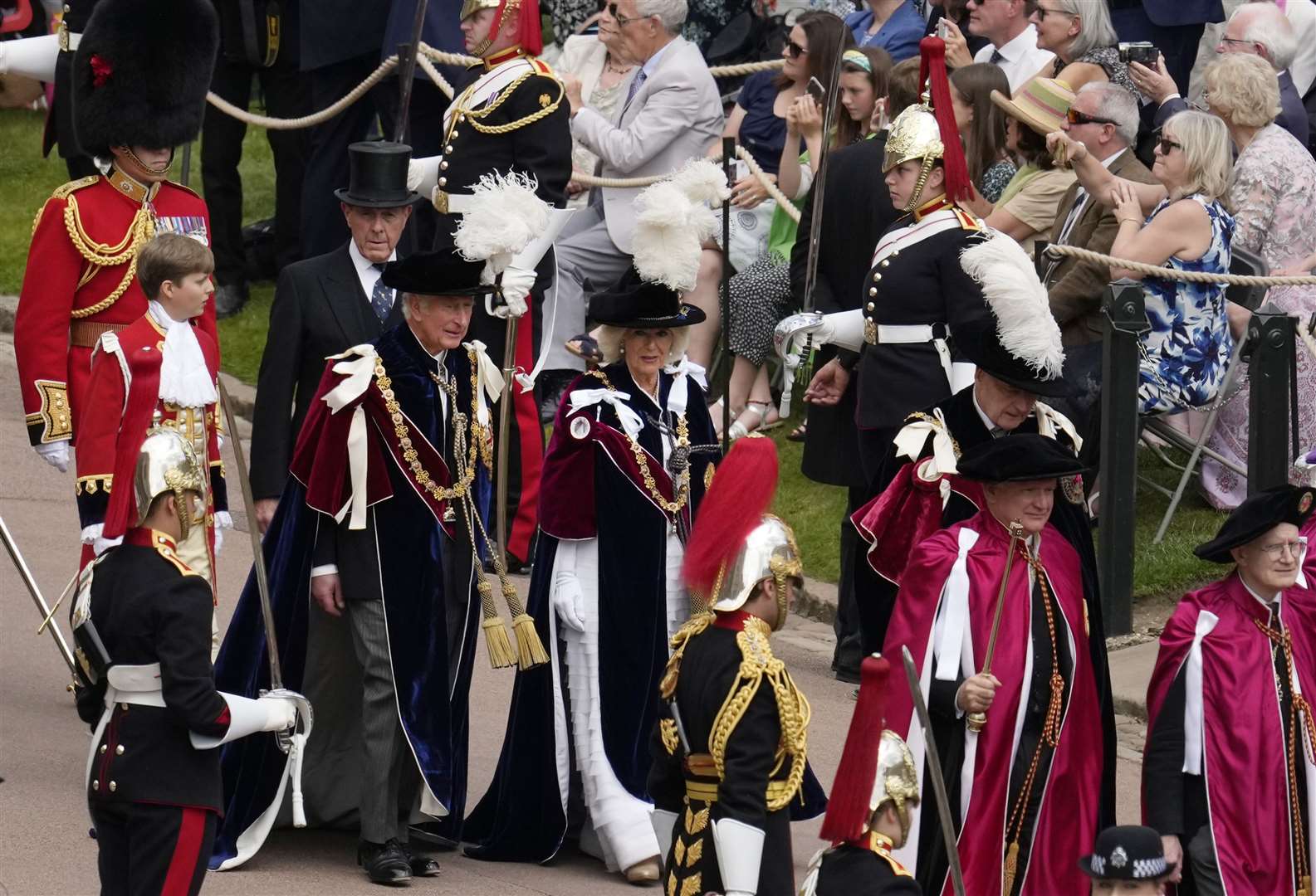 The Prince of Wales and the Duchess of Cornwall walk in the procession ahead of the annual Order of the Garter Service (Matt Dunham/PA)