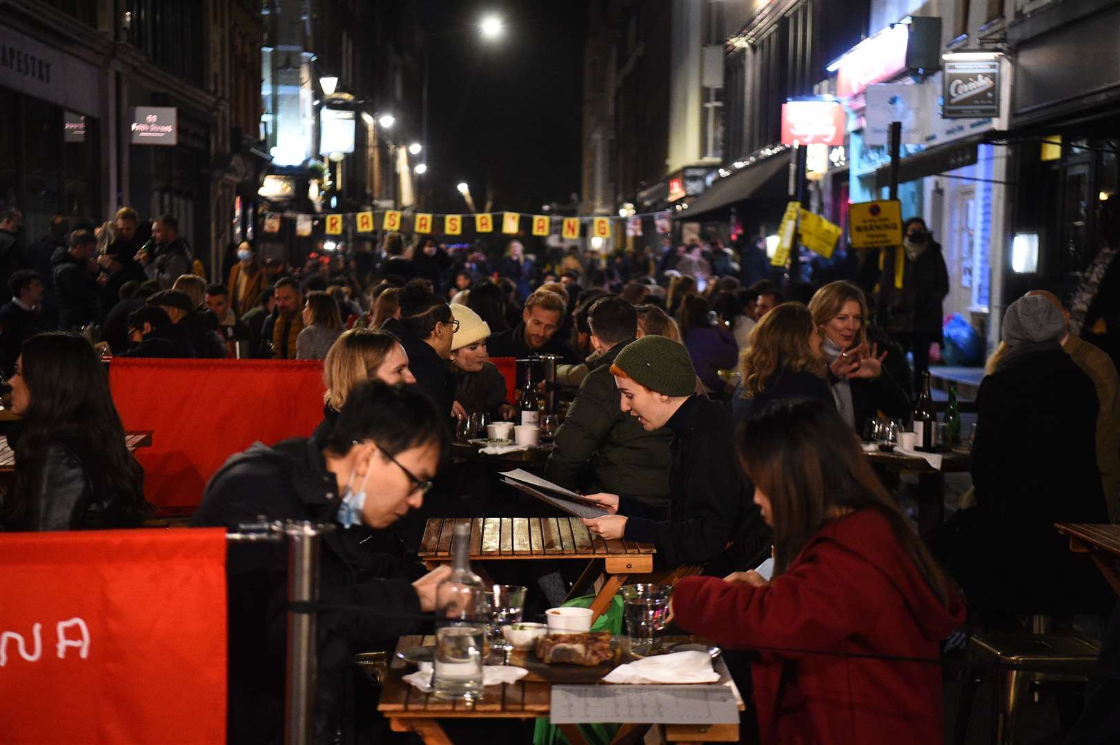 People out on Old Compton Street in London, ahead of the national lockdown (Kirsty O’Connor/PA)