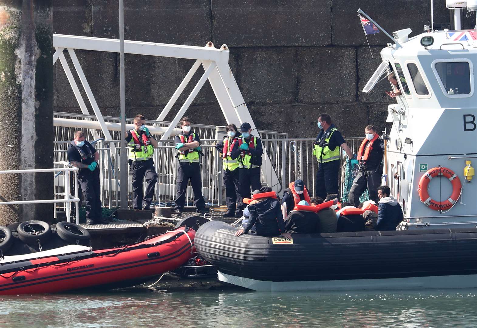 Border Force officers prepare to bring to shore men thought to be migrants in Dover after small boat incidents in The Channel last weekend (Gareth Fuller/PA)