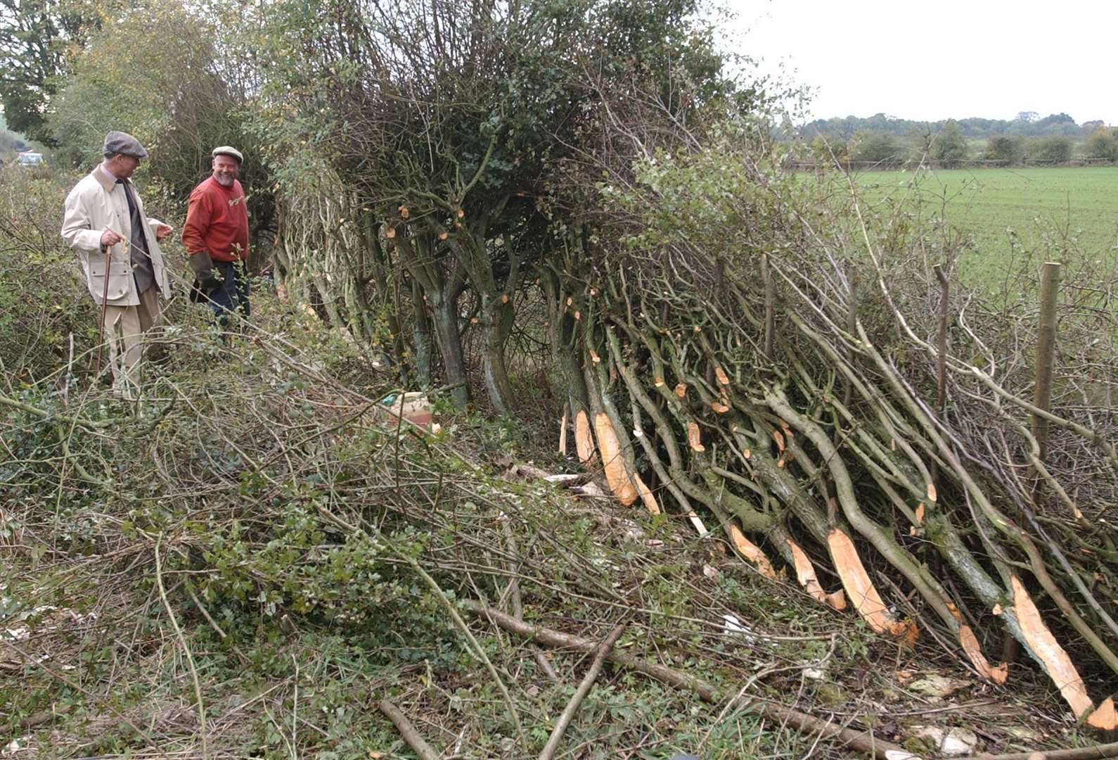 Charles talking to a competitor in the National Hedgelaying Championships at Tetbury in 2005 (Barry Batchelor/PA)