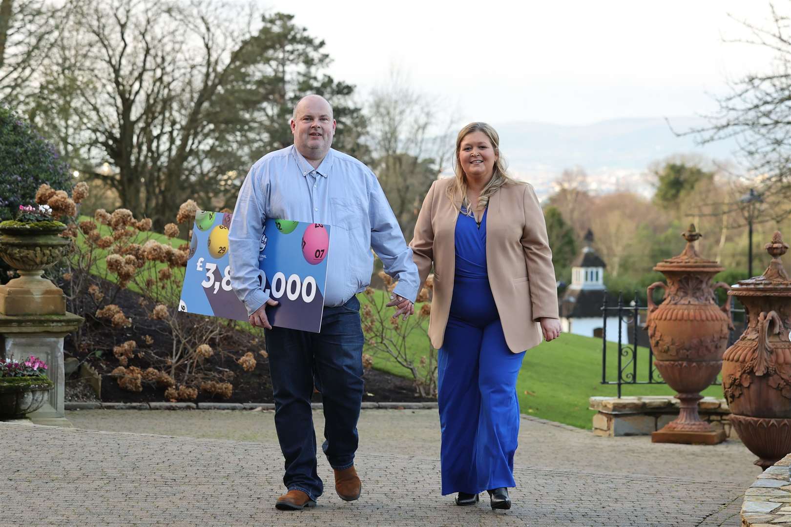 Jonny Johnston and his partner, Christina Williams, celebrate at the Culloden Estate & Spa Hotel in Belfast after winning £3.8m (Liam McBurney/PA)