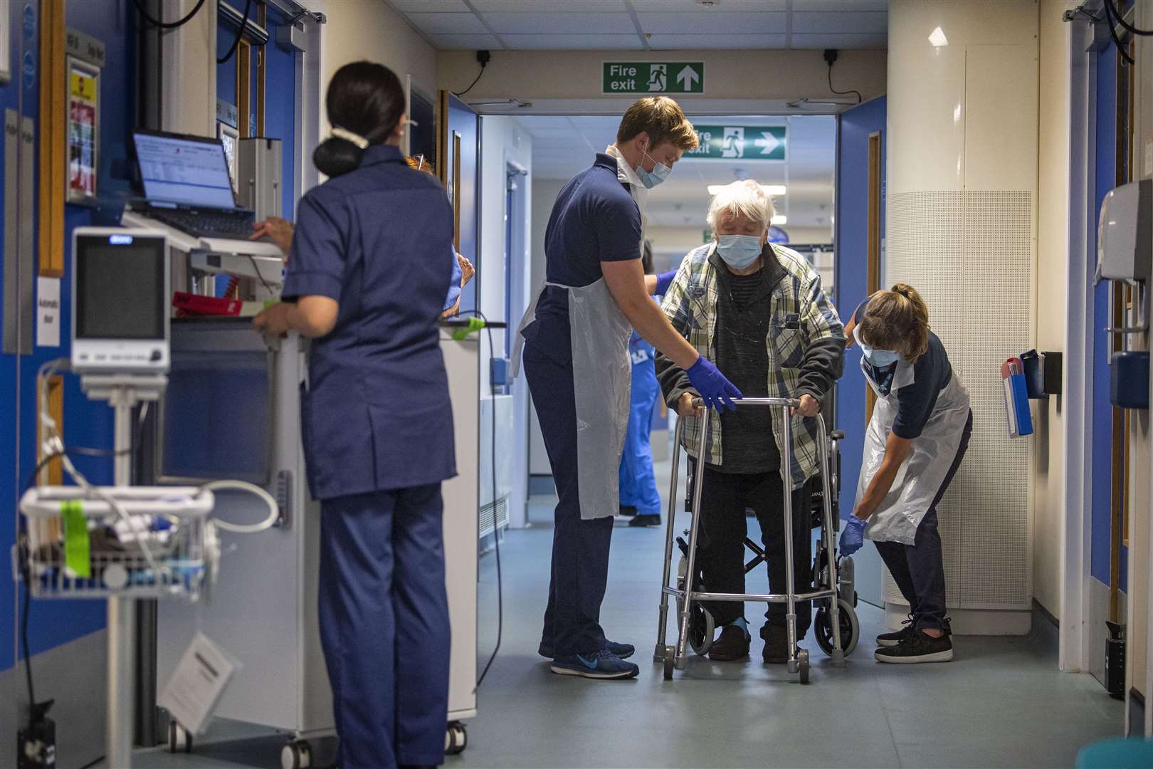 Rehab support workers give physiotherapy treatment to Michael Kidd (Victoria Jones/PA)