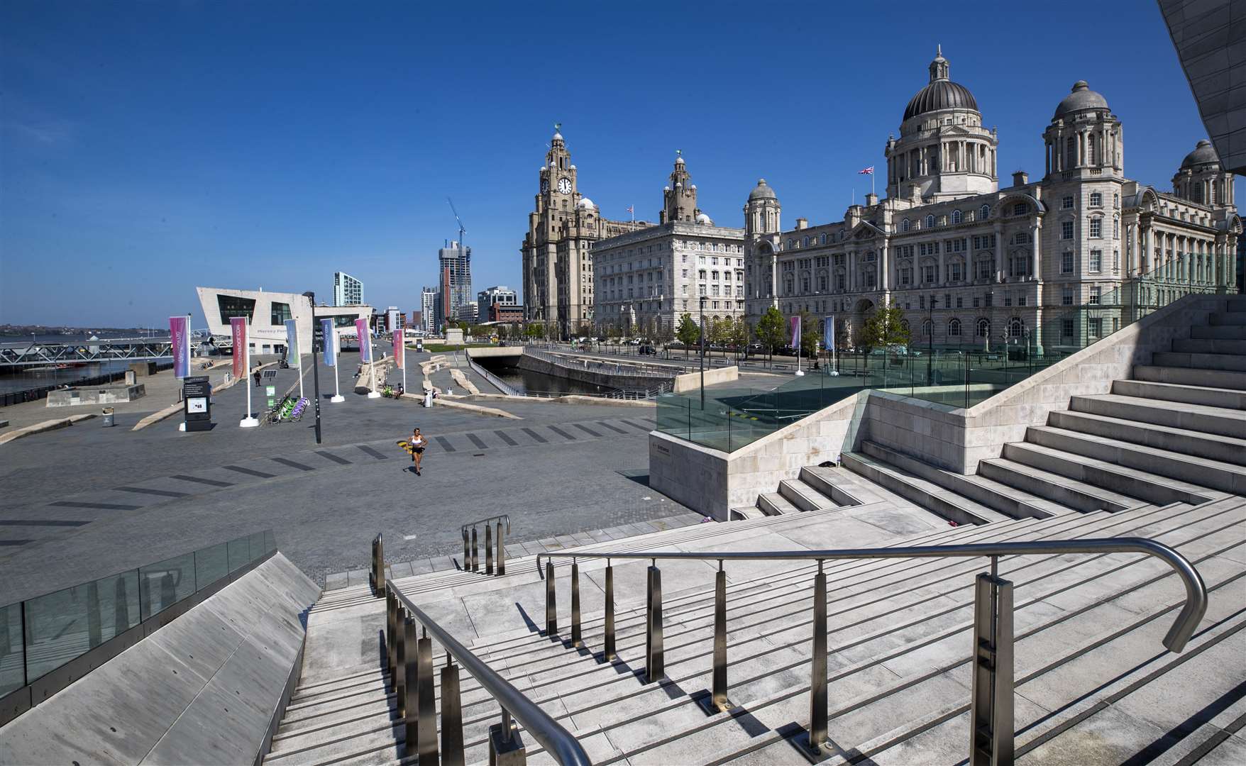 Liverpool waterfront is practically deserted as shops and business remain closed (Peter Byrne/PA)