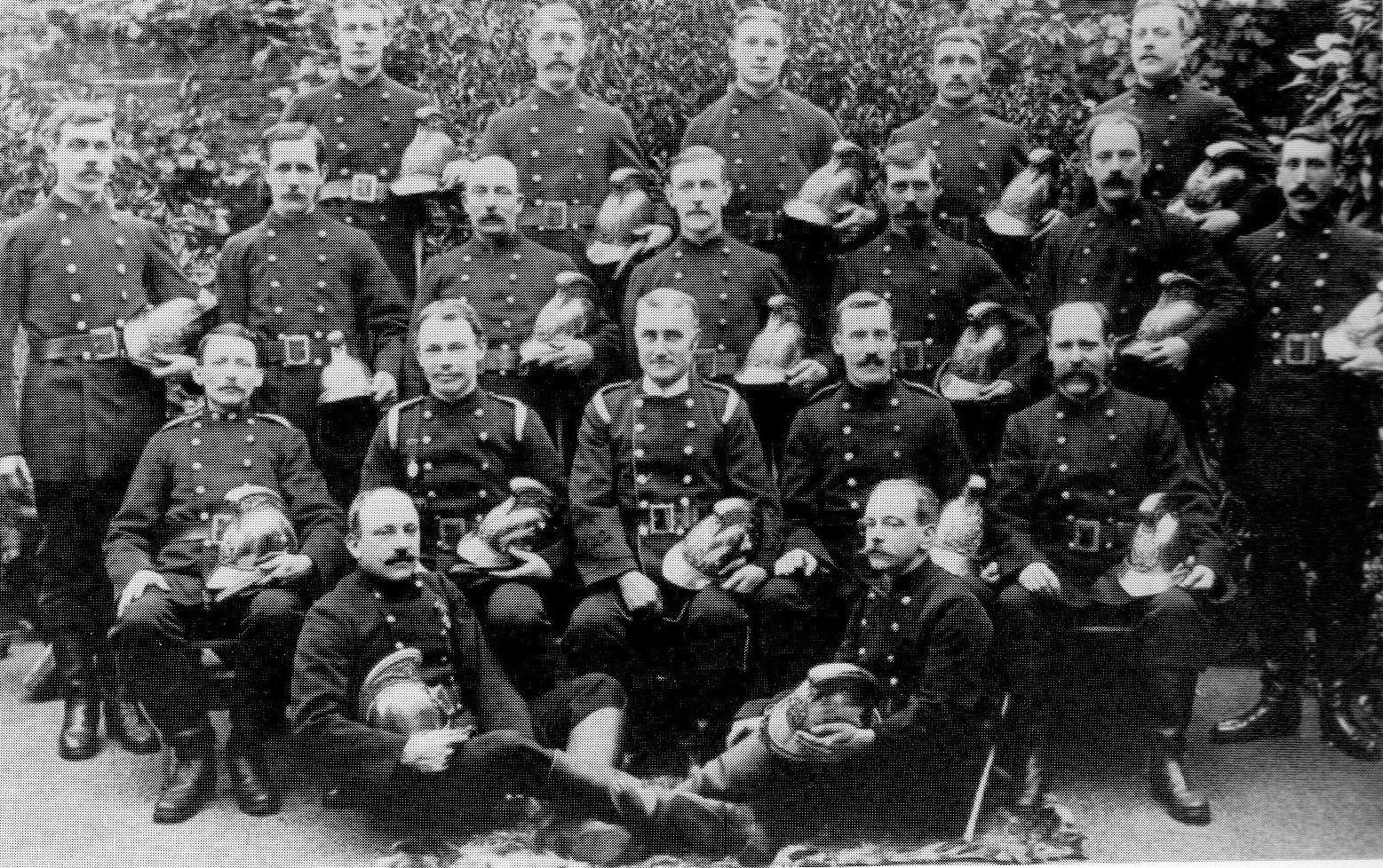 Leslie Pearce is in the centre of the middle row, pictured with his brigade colleagues, including his brother Sidney on the left