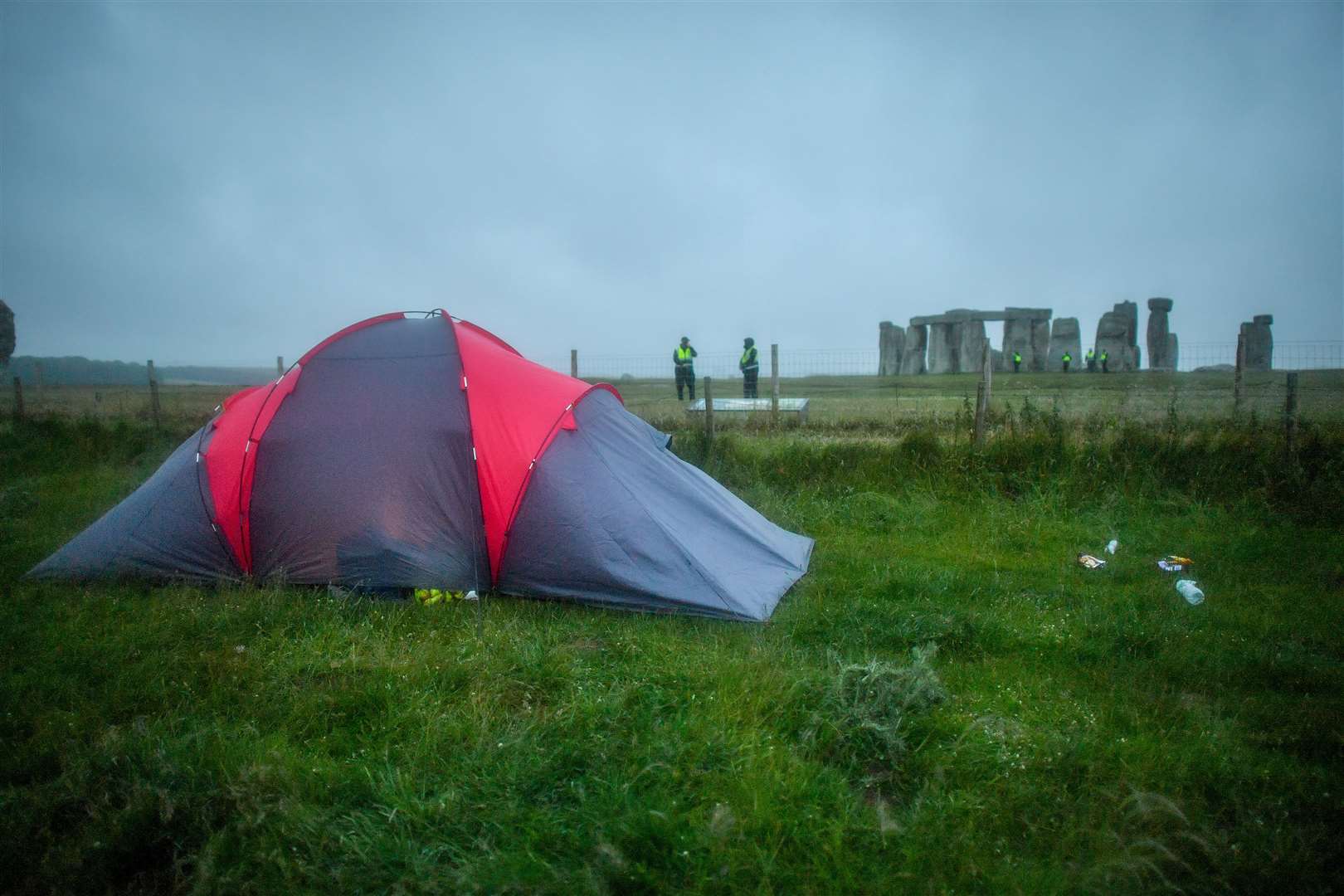 People had camped near to the closed landmark to watch the dawn (Ben Birchall/PA)