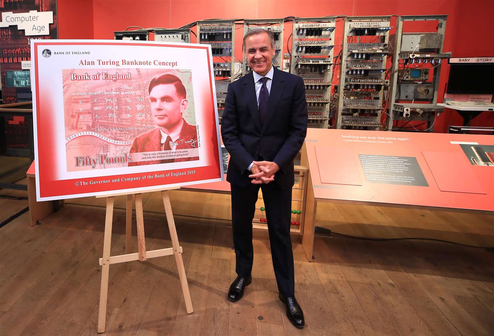 Former Bank of England, Mark Carney, showed off the new £50 polymer note, made by De La Rue, last year (Peter Byrne/PA)