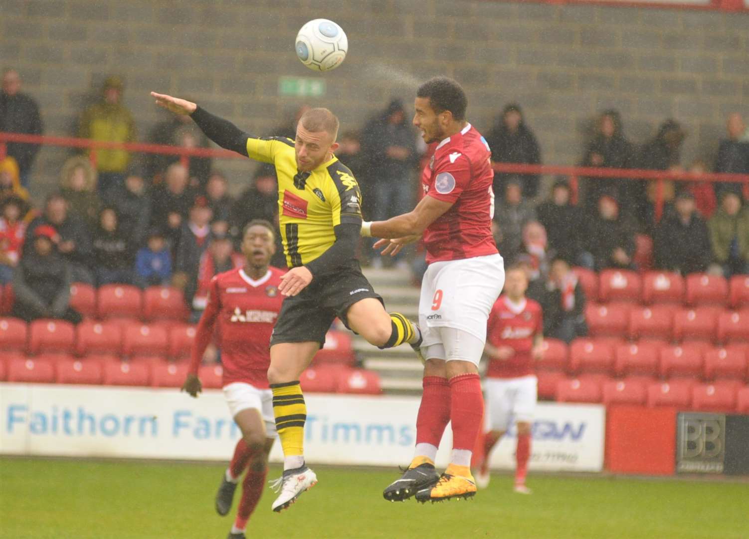 Chris Bush wins a header in the wet against Harrogate Picture: Steve Crispe