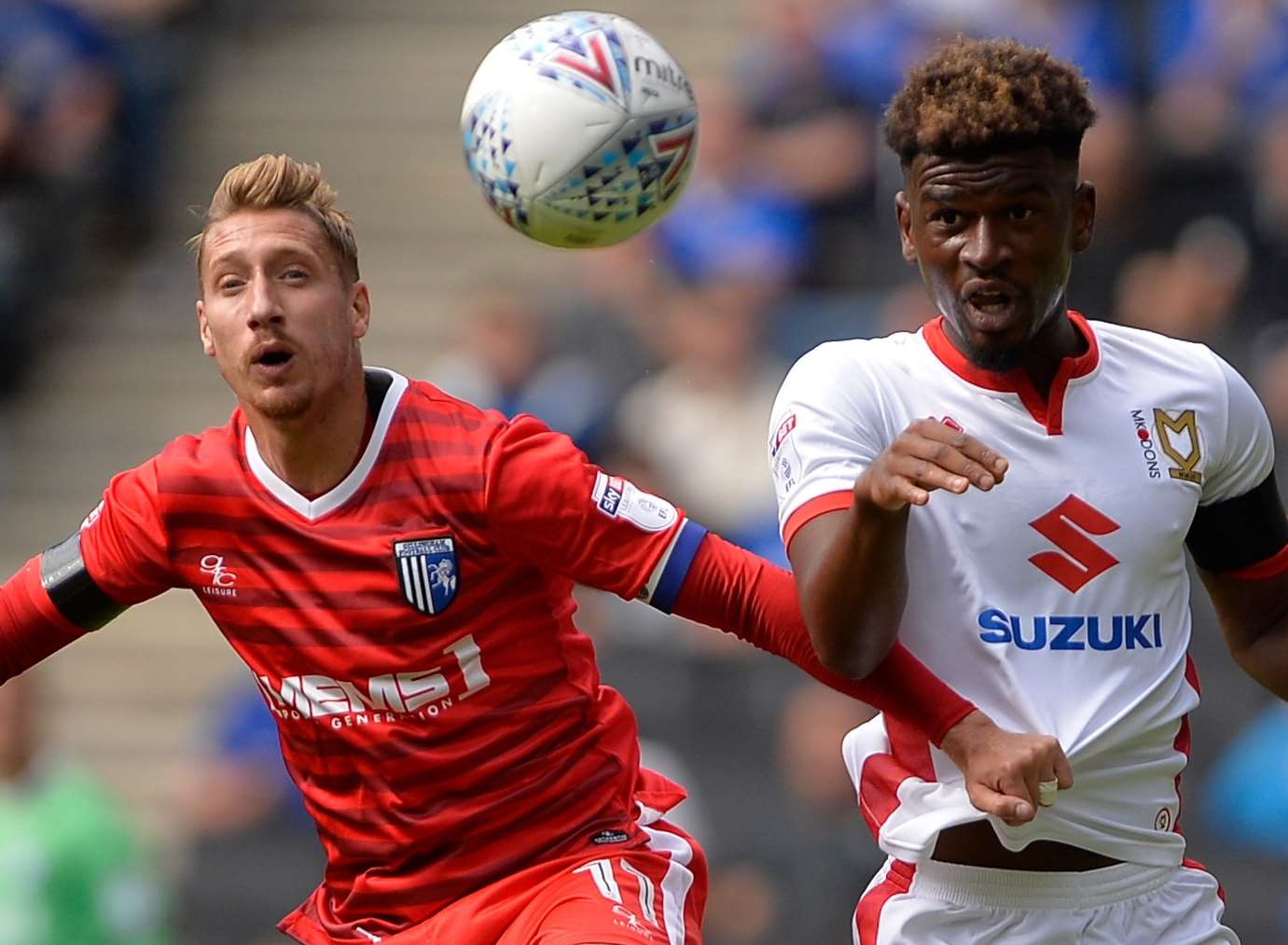 Gillingham’s Lee Martin challenges with MK Dons' Aaron Tshibola. Picture: Ady Kerry