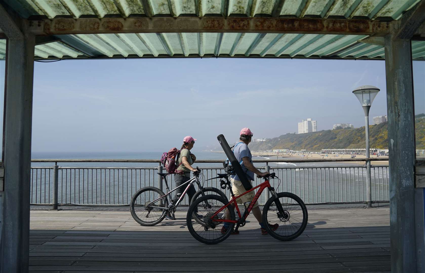 People walk along Boscombe pier in Dorset (Andrew Matthews/PA)