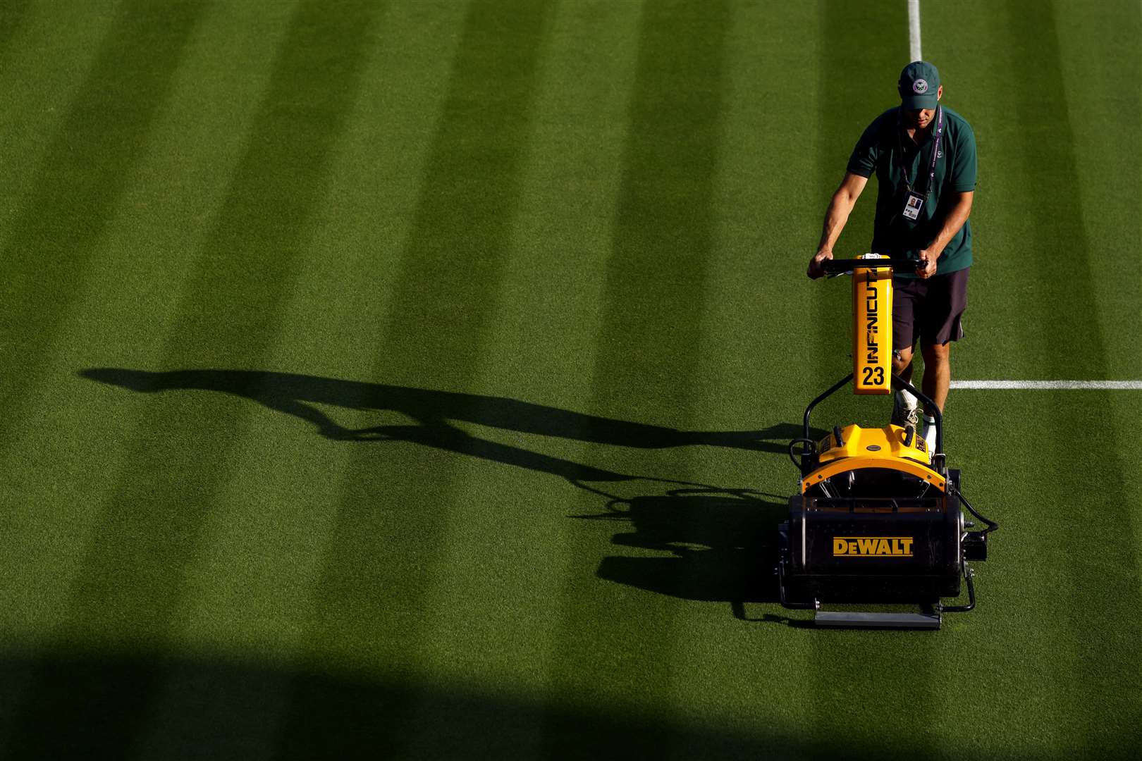 Ground staff make final court preparations before play starts on Monday (Steven Paston/PA)