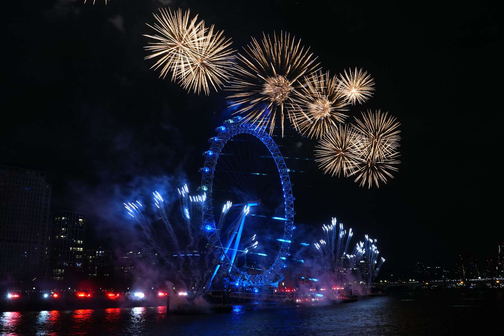 Fireworks light up the sky over the London Eye (Lucy North/PA)