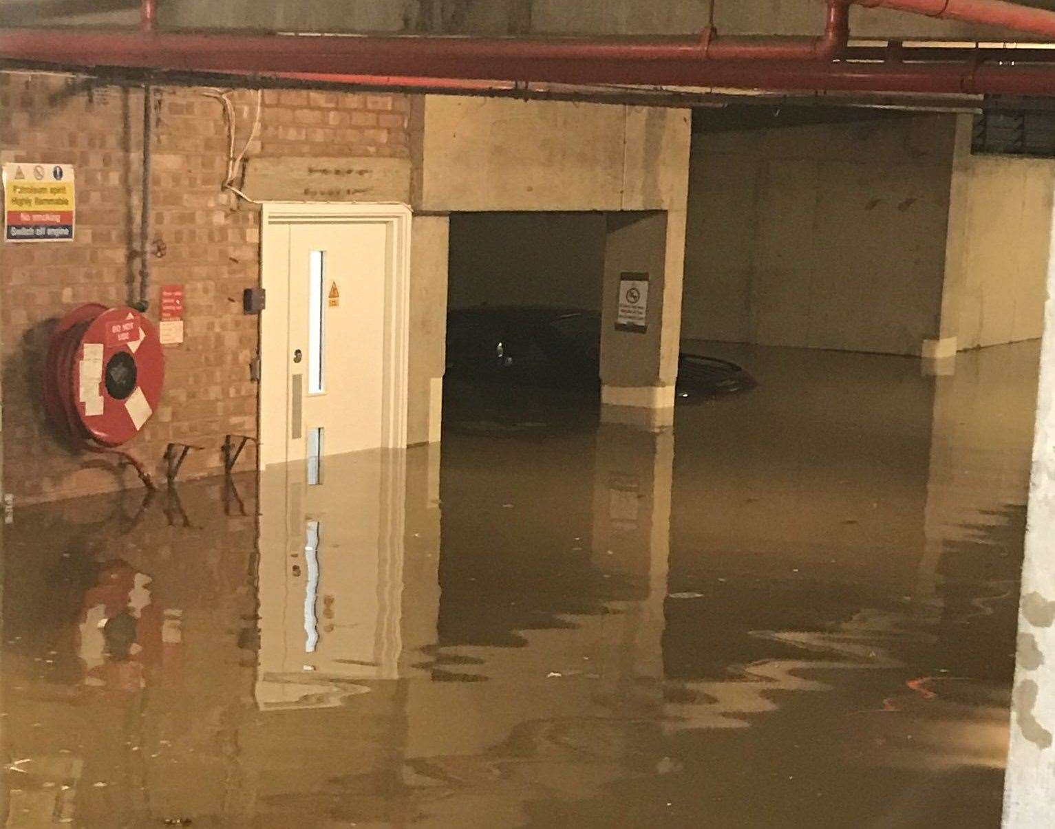 One of the cars submerged in flood water at Riverbank House. Picture: @tahnee_nicola