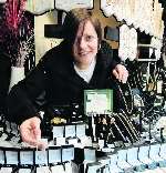 Pickwick Pawnbrokers manager Debbie Franklin shows the jewellery in the window display
