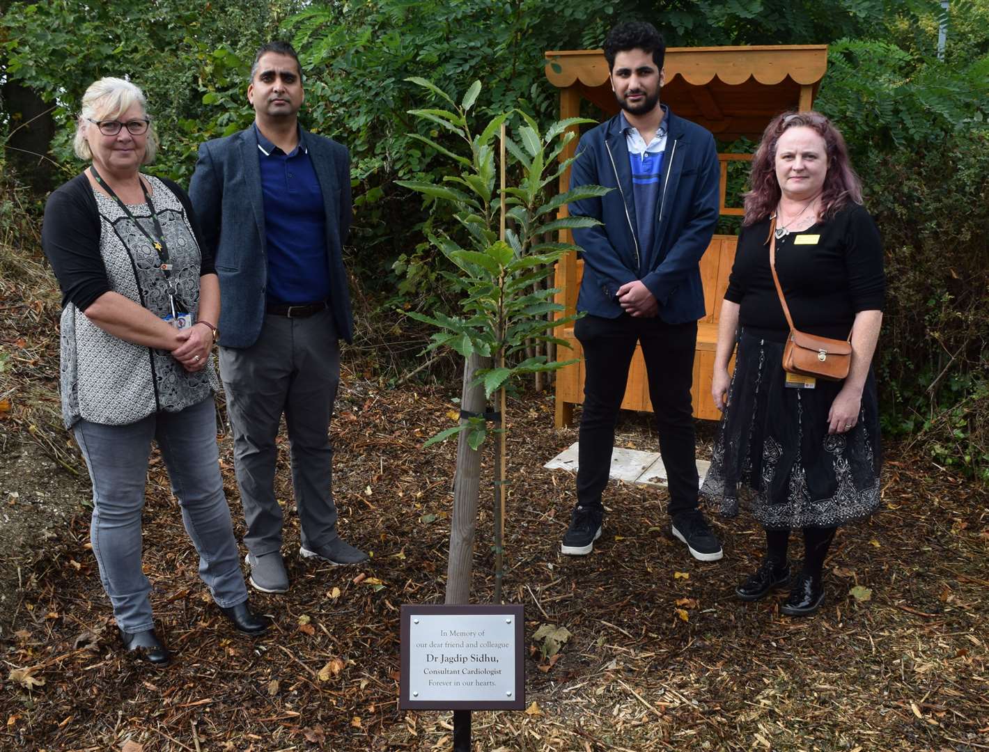 Friends and family of Dr Jagdip Sidhu, including brother Amandip, second from left, unveiled a plaque outside Darent Valley Hospital