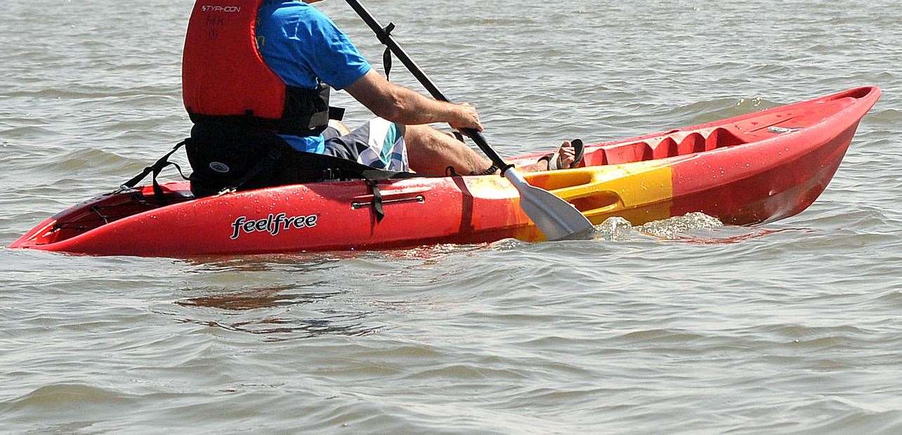 Two kayakers were tipped into the river