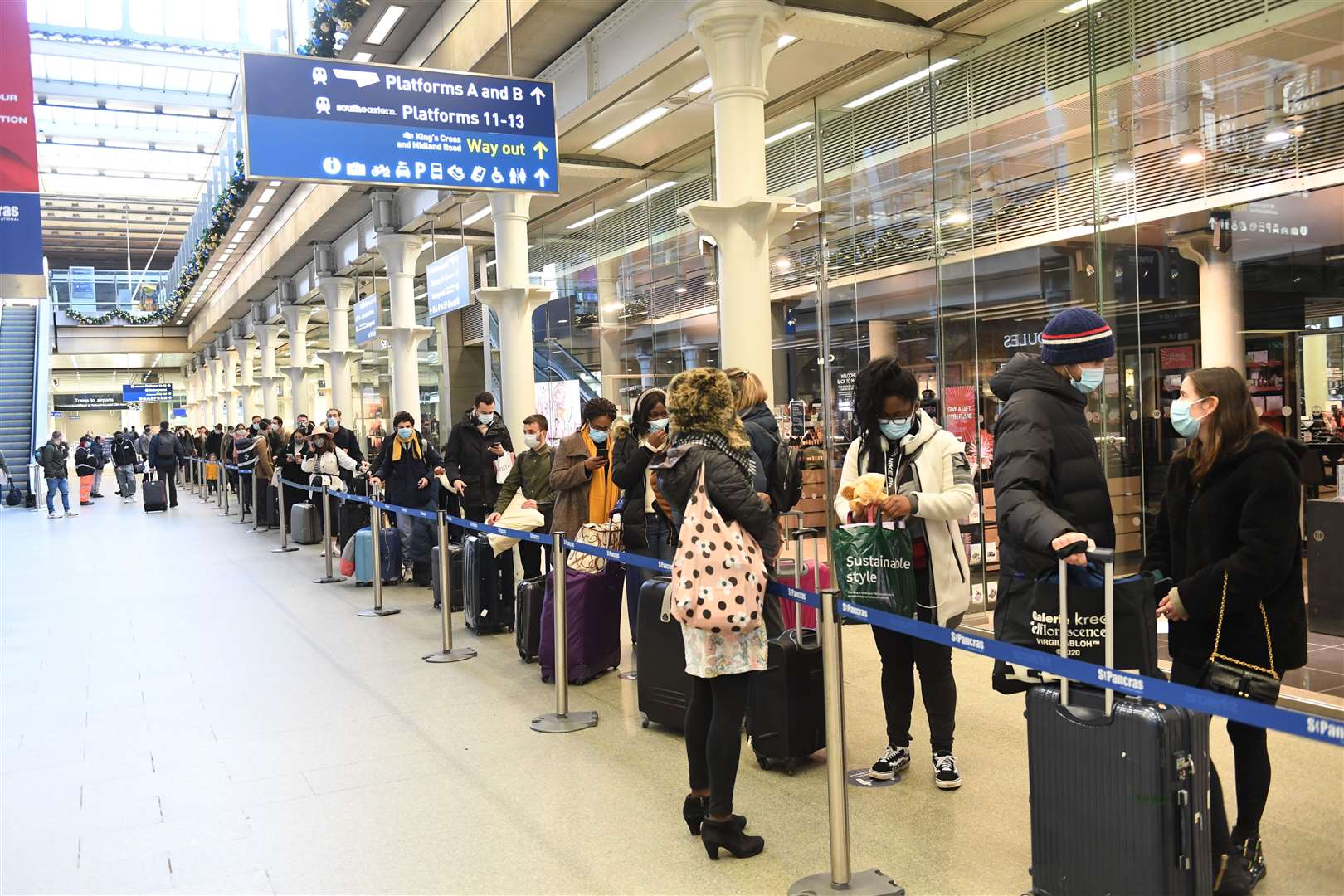 People at St Pancras station in London waiting to board the last train to Paris on Sunday (PA)