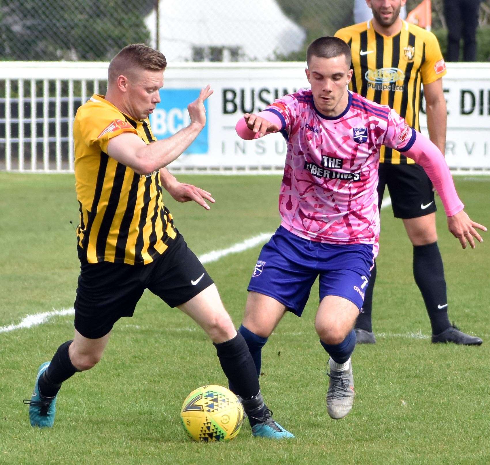 Benas Vaivada, of Margate, and Folkestone midfielder Scott Heard battle for the ball in Invicta's 1-0 home loss on Monday. Picture: Randolph File