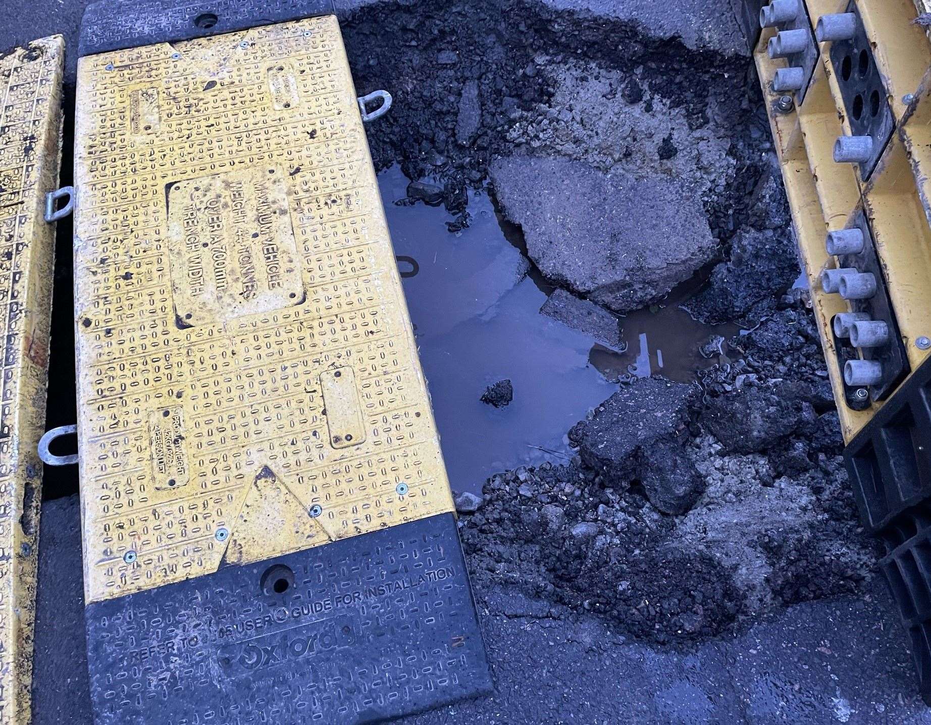 The tarmac in Church Road, Murston, caved in after motorists drove over the works