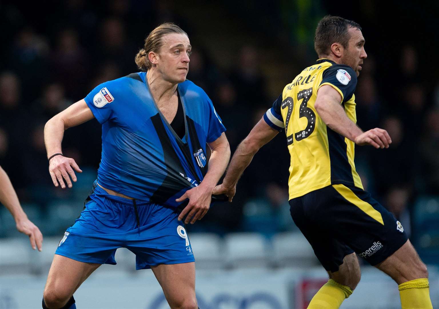 Tom Eaves has his shirt pulled by Rory McArdle in the recent game with Scunthorpe Picture: Ady Kerry