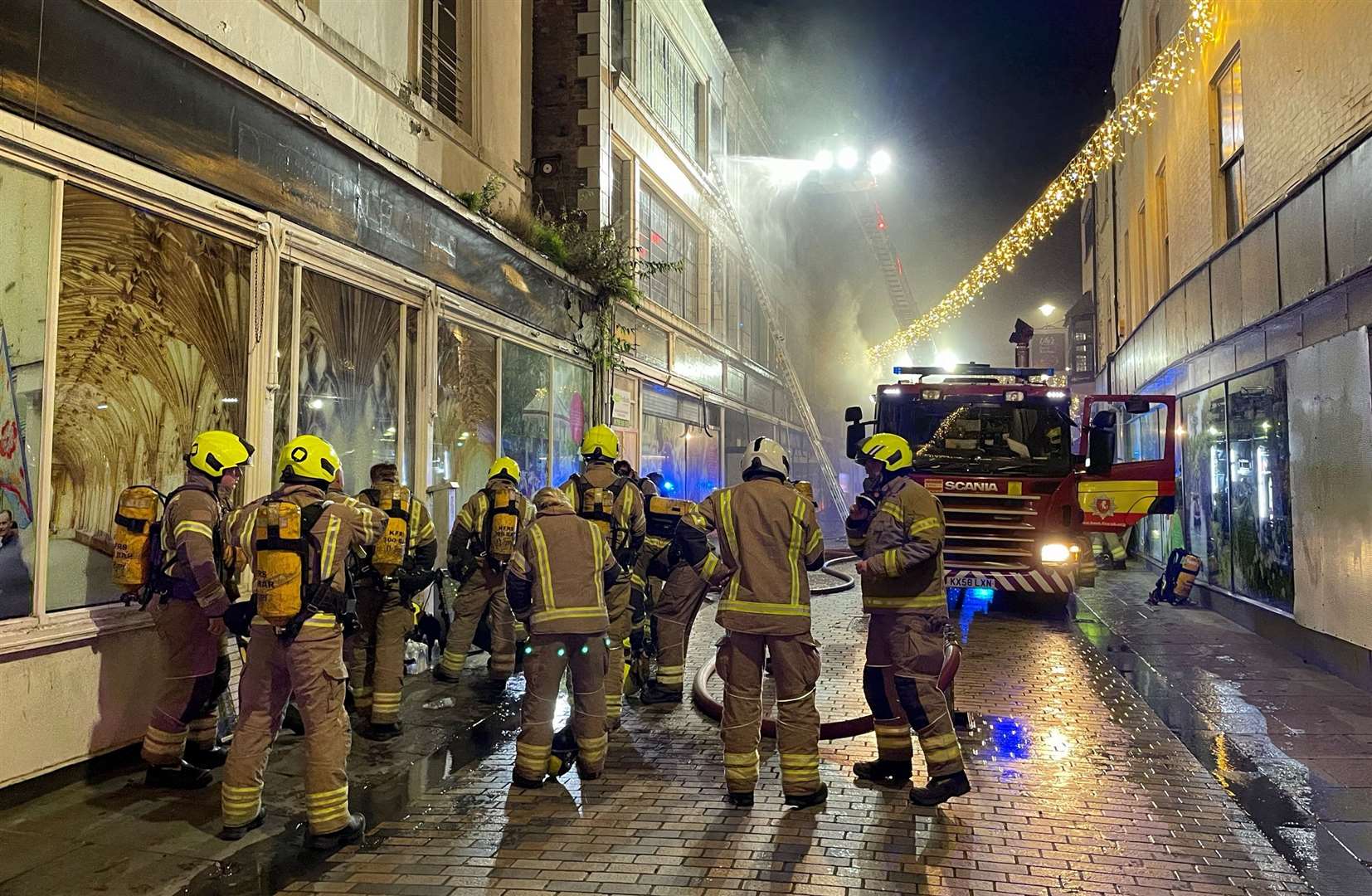 Fire crews in Canterbury High Street battling the Debenhams blaze. Picture: KFRS