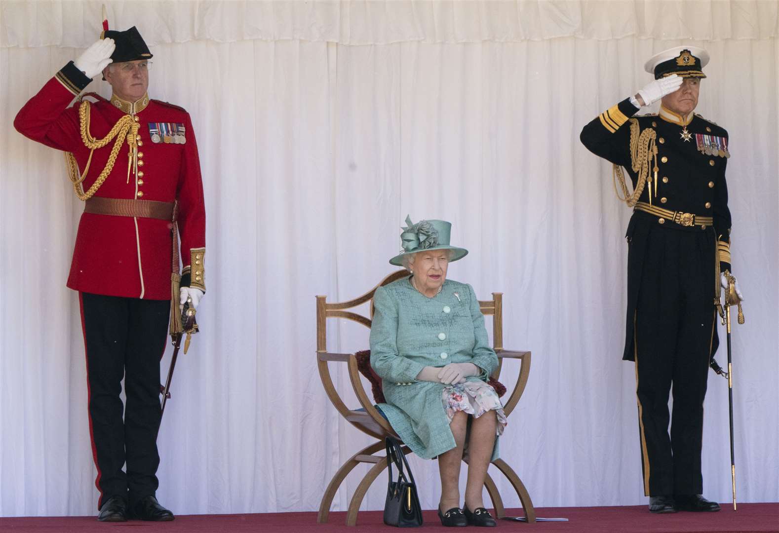 The Queen watching last year’s military ceremony that marked her official birthday (Paul Edwards/The Sun)