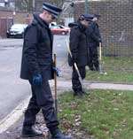 Police officers comb the area for clues. Picture: JOHN WARDLEY