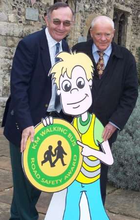Brian Constable and Alan Harvey of the Co-op with Jack the Walking Bus road safety character