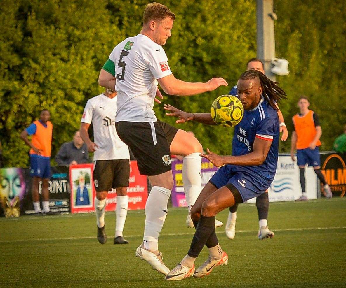 Margate striker Ibrahim Olutade challenges Dartford skipper Josh Hill. Picture: Stuart Watson