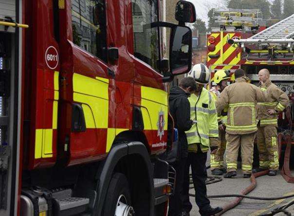 Fire fighters helped release a man from a car that had become trapped under the trailer of a lorry.
