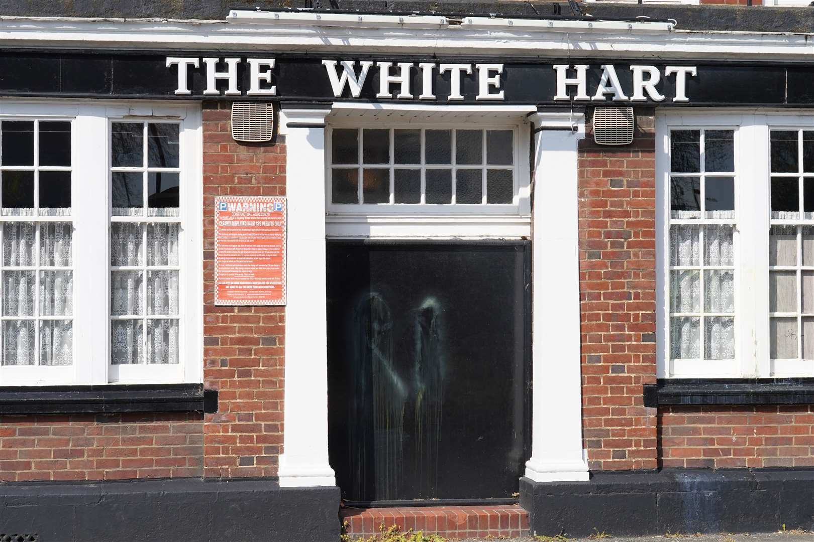 Paint on the door of the vandalised White Hart Inn (Stefan Rousseau/PA)