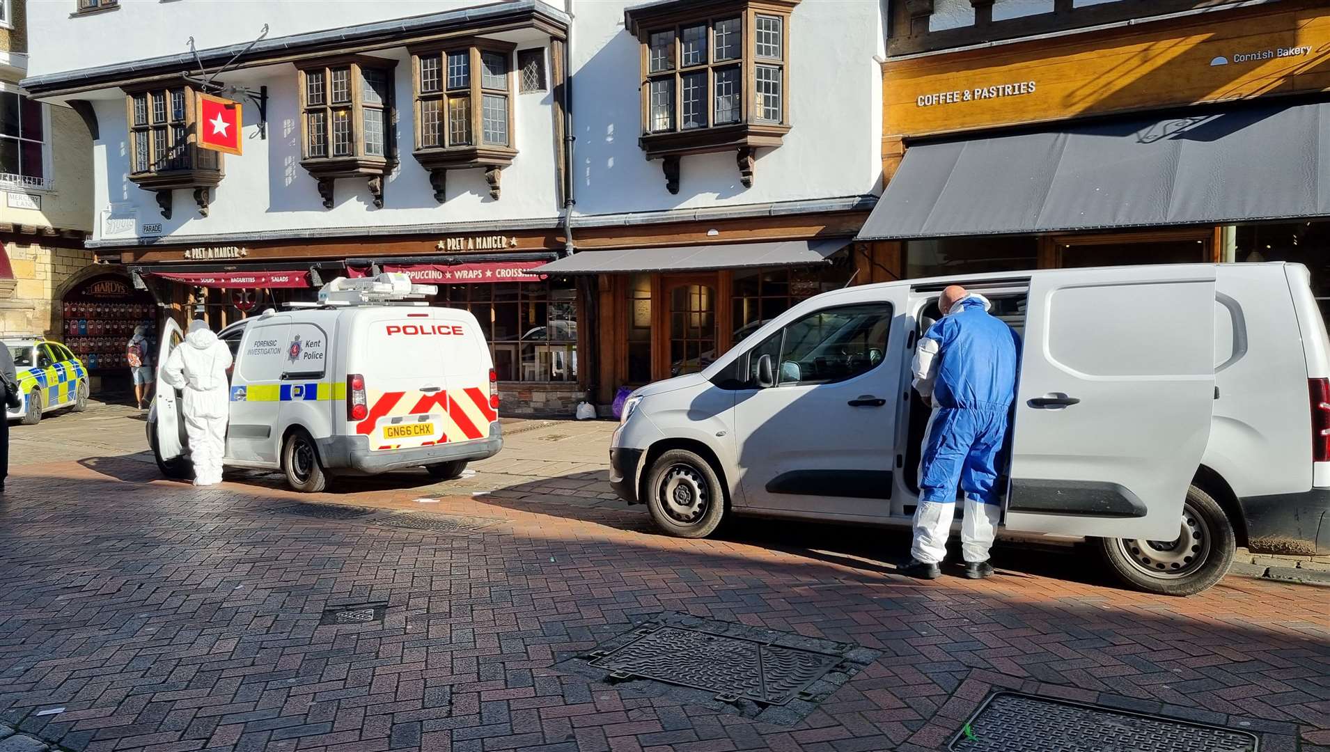 Forensics working in Canterbury High Street after a suspected murder probe was launched