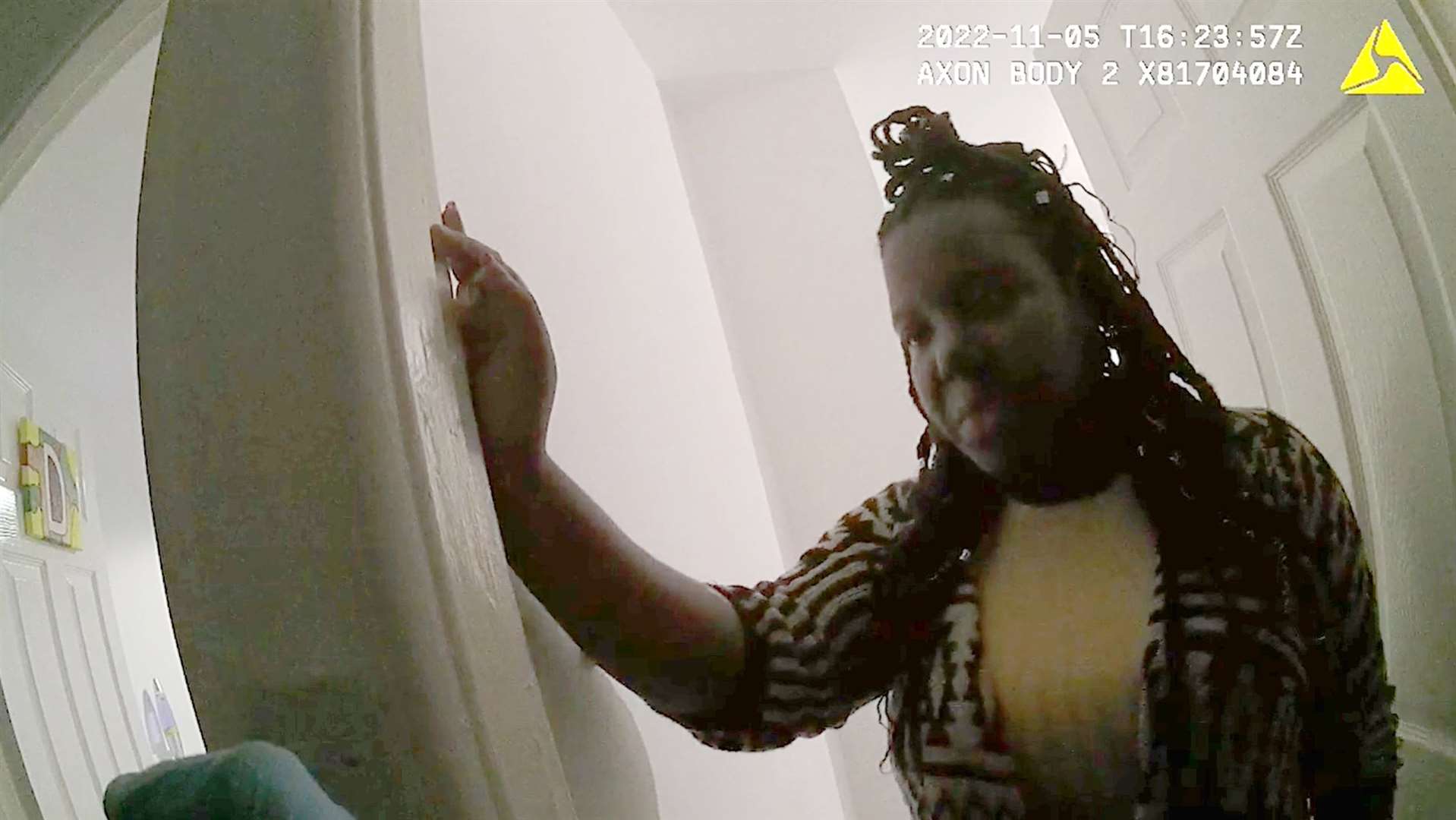 Body-worn camera footage of Christina Robinson talking to police as nearby paramedics worked desperately to save her son (Crown Prosecution Service/PA)