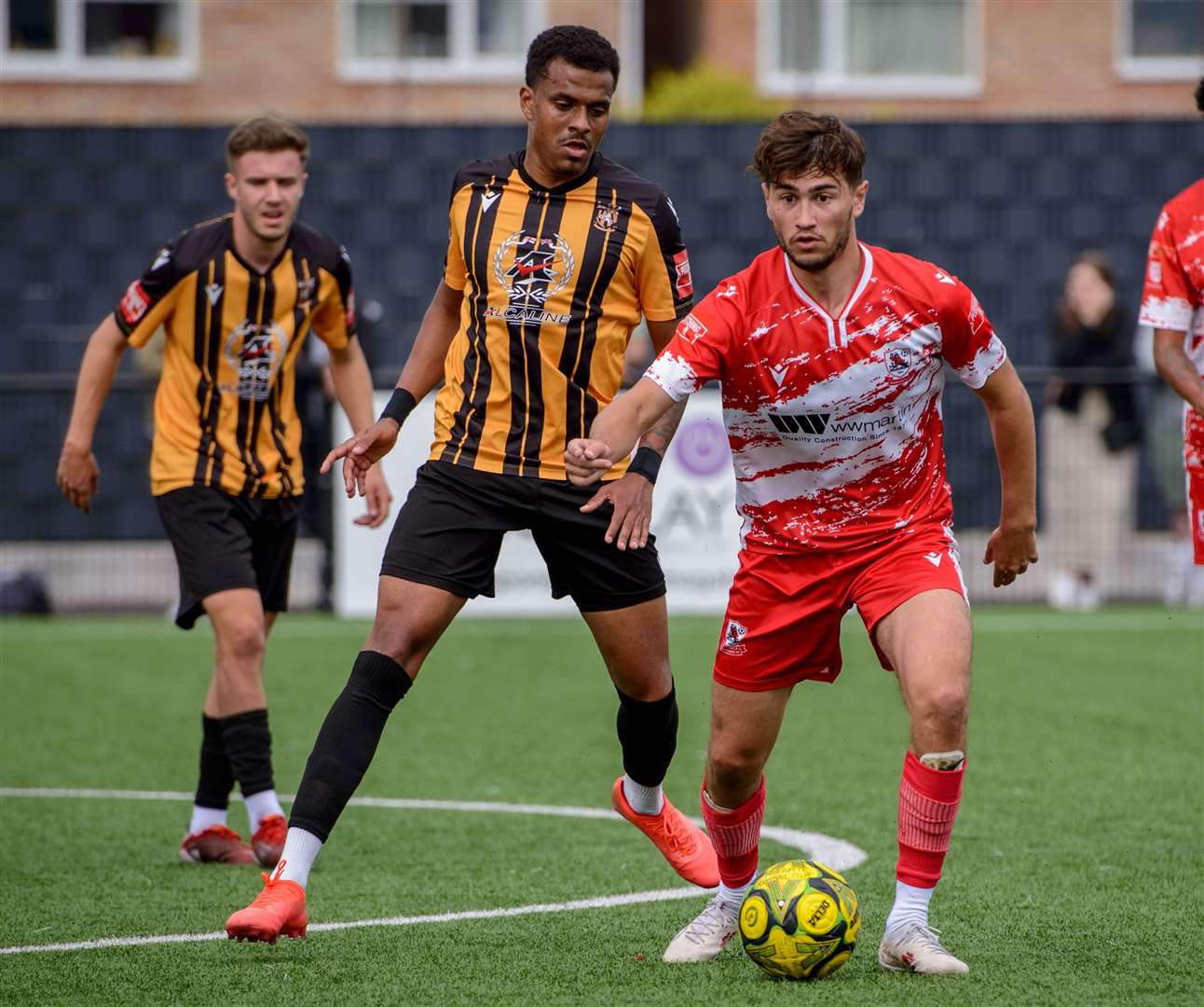 Ramsgate’s Lewis Gard takes on Folkestone defender Jamie Mascoll in Invicta’s 3-1 FA Cup loss at Southwood on Saturday. Picture: Stuart Watson