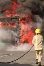 A fireman closes in on the flames. Picture: Jeremy Frankel