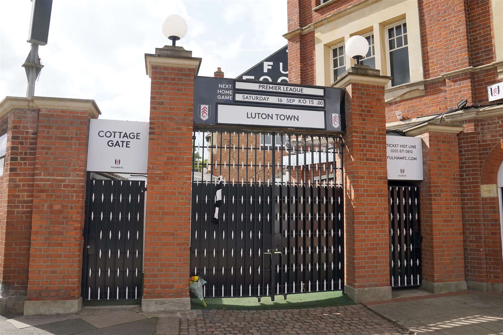 A floral tribute and a scarf at Craven Cottage after the death of former Fulham chairman and Harrods owner Mohamed Al-Fayed (Stefan Rousseau/PA Wire)