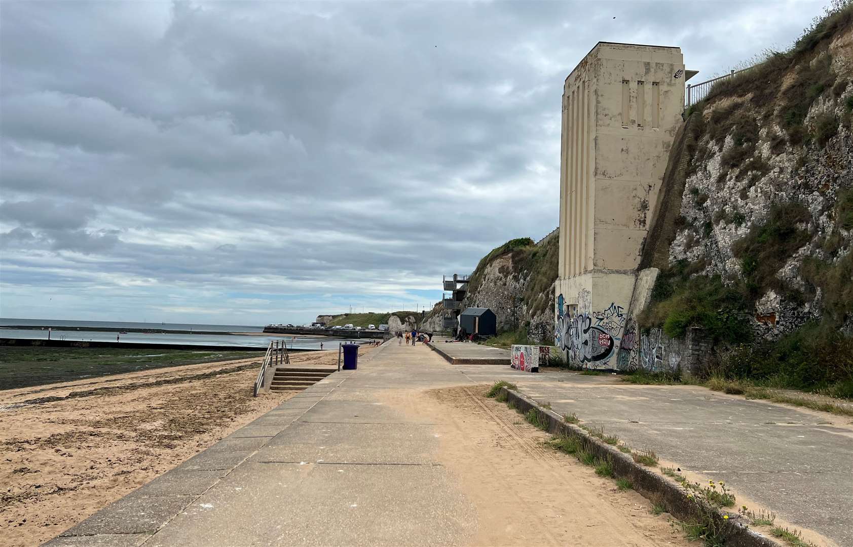 The art deco lift no longer in use from the sea path - with the tidal pool just behind