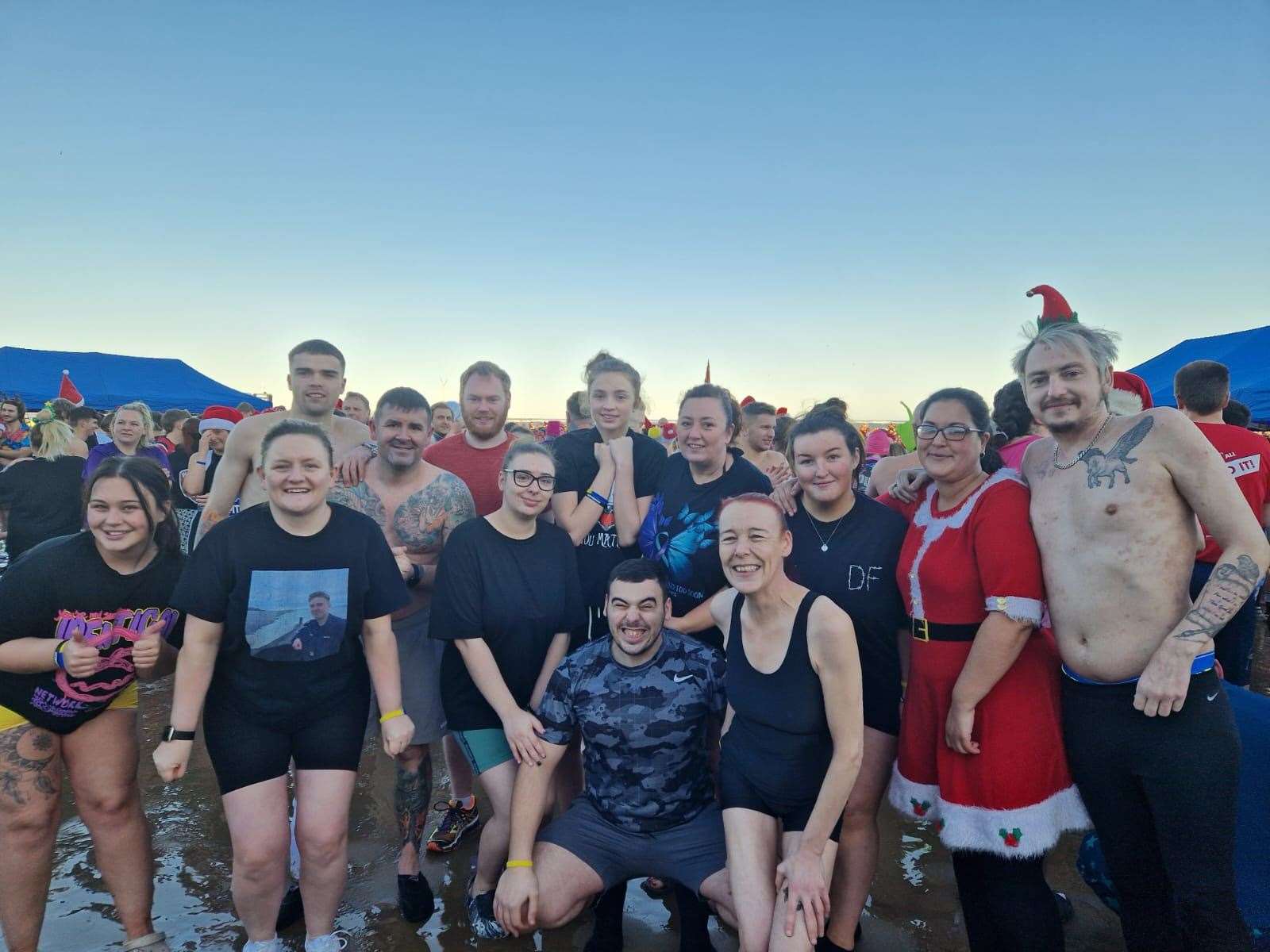 Tom Poole (far right) said he is going to do the swim again next year (Tom Poole/PA)