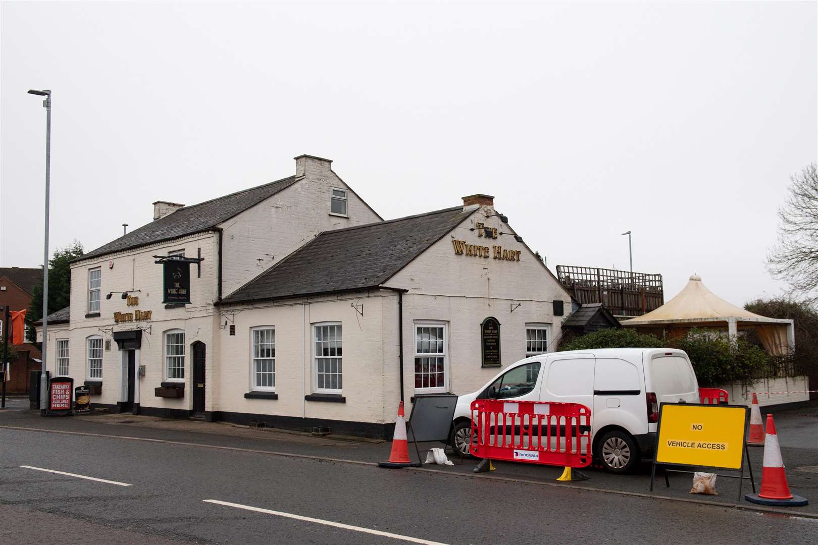 A Covid-19 mobile testing unit set up at the White Hart pub in Fernhill Heath, near Worcester (Jacob King/PA)