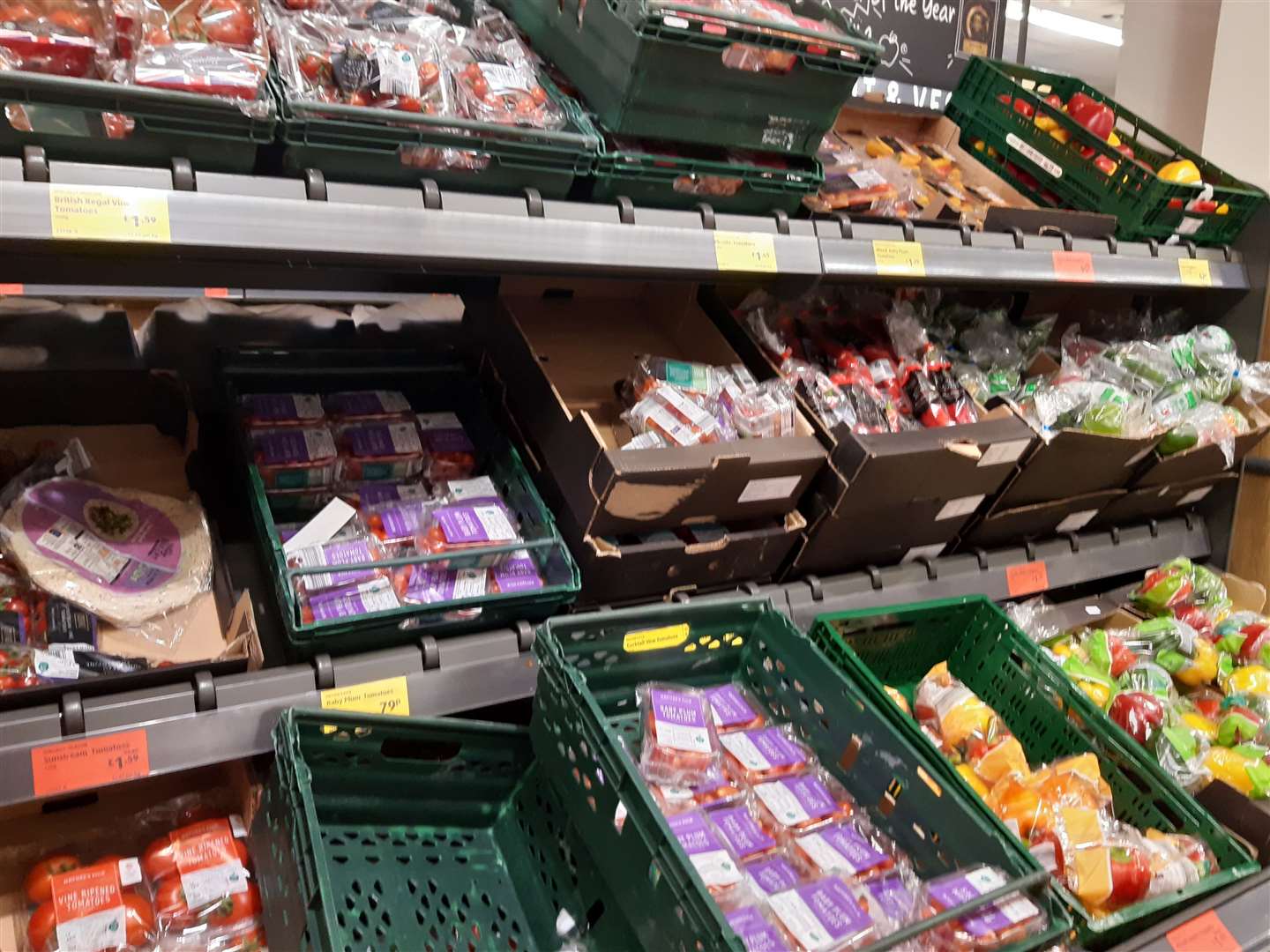 Fruit wrapped with plastic trays in plastic in Aldi, High Street, Gillingham