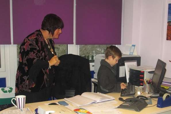 Head teacher Debbie Wheeler shows Joshua the ropes