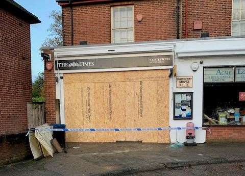 The shop’s windows were smashed after a car was driven into the front