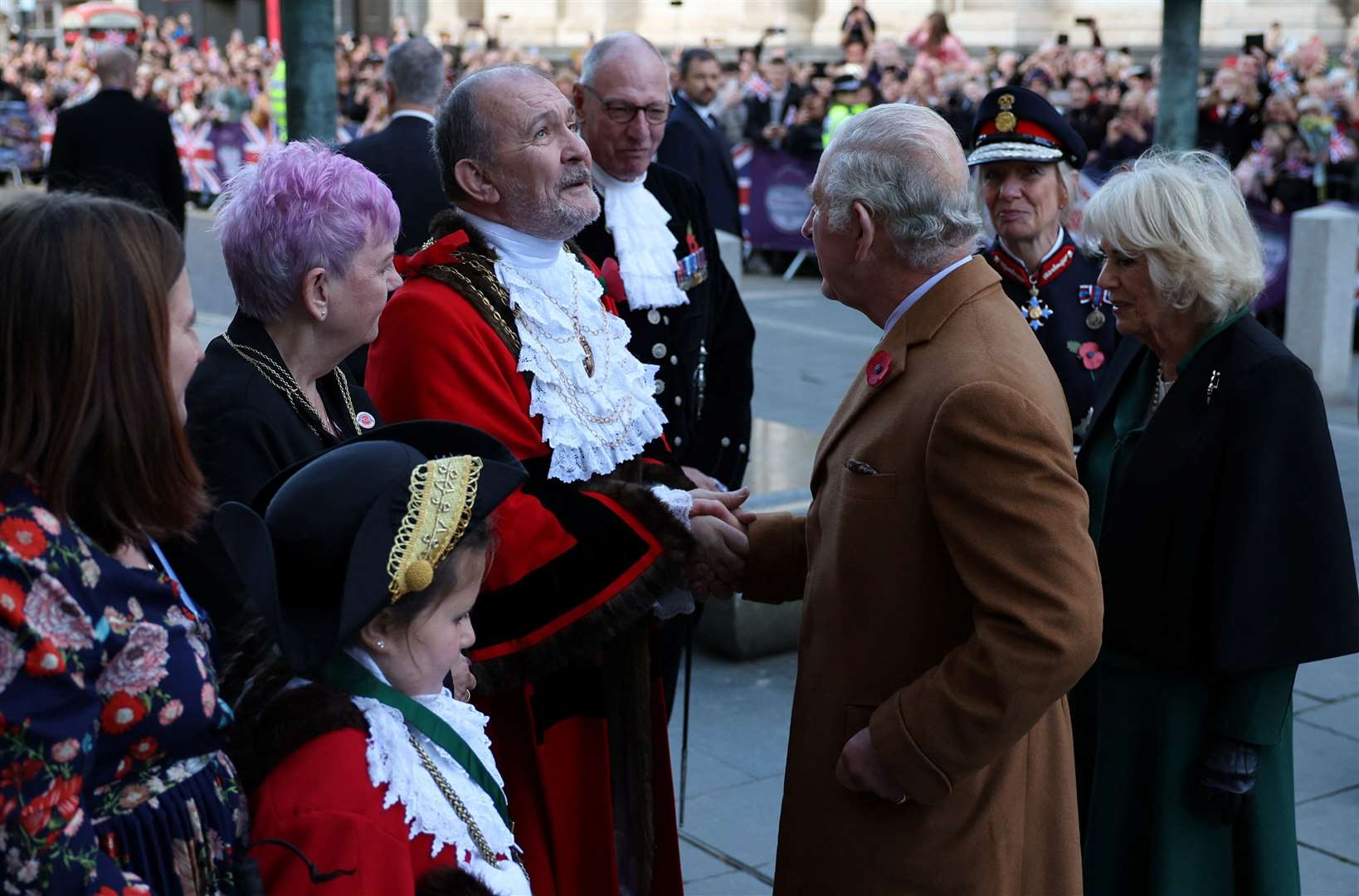 Charles and Camilla are greeted by civic mayor Ian Pearson as they arrive for a ceremony at Mansion House to confer city status on Doncaster (Molly Darlington/PA)