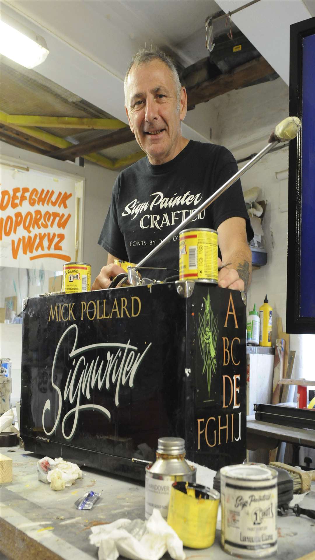 Award winning signwriter "Mick the Brush", aka Mick Pollard