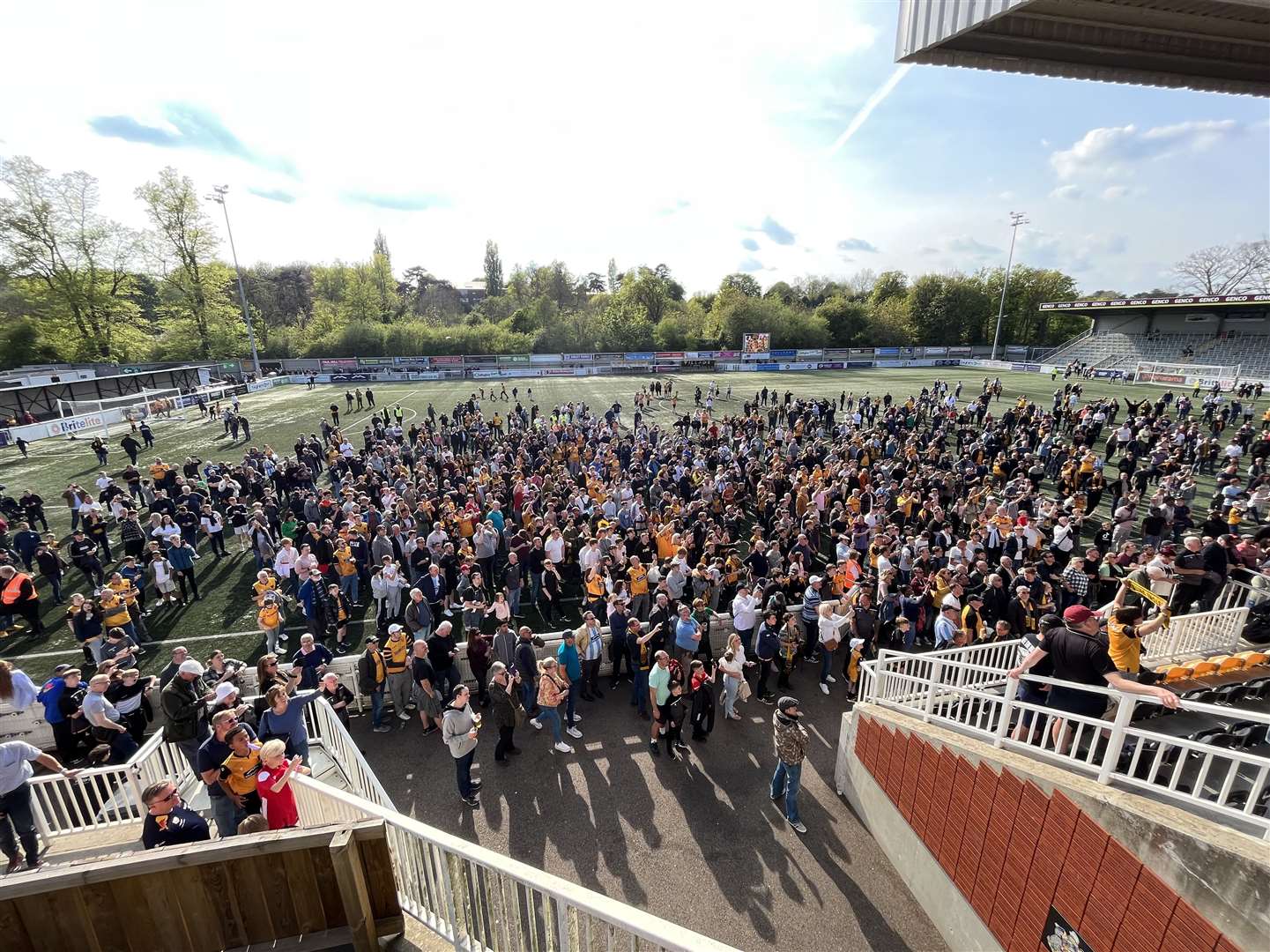 Maidstone United fans celebrate at full-time winning the National South title