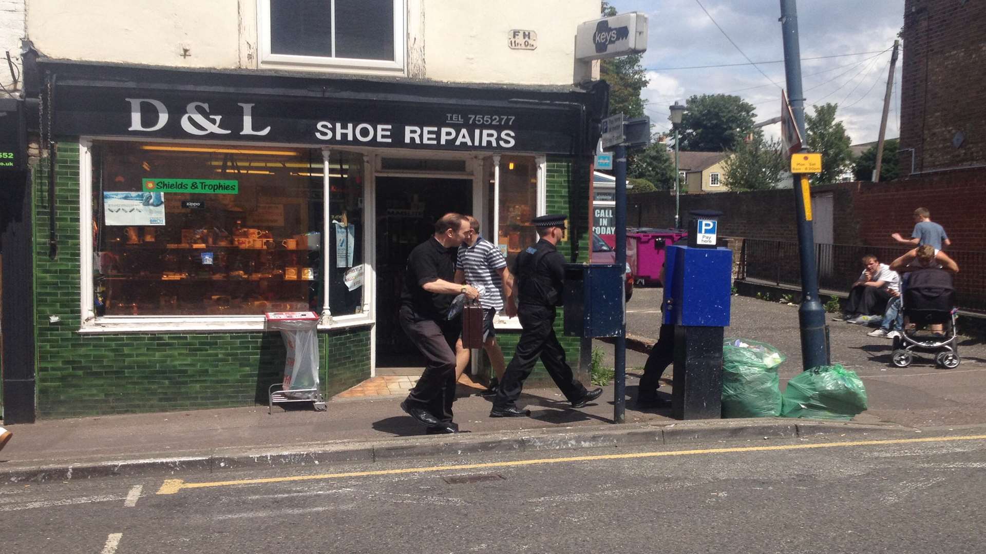 Police and trading standards shortly after raiding the 420 Head Shop in Maidstone