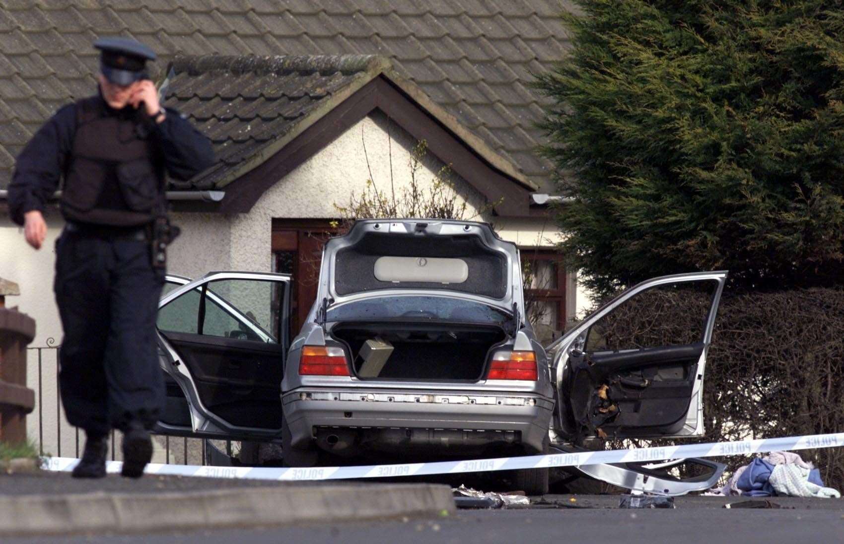 Security forces at the scene of the explosion in Lurgan (Paul Faith/PA)